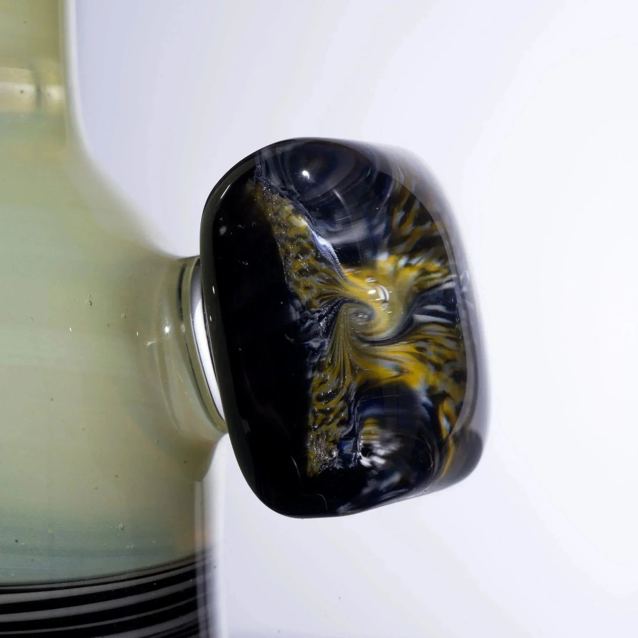 Handblown glass pipe with black and gold swirls, premium heady glass accessory