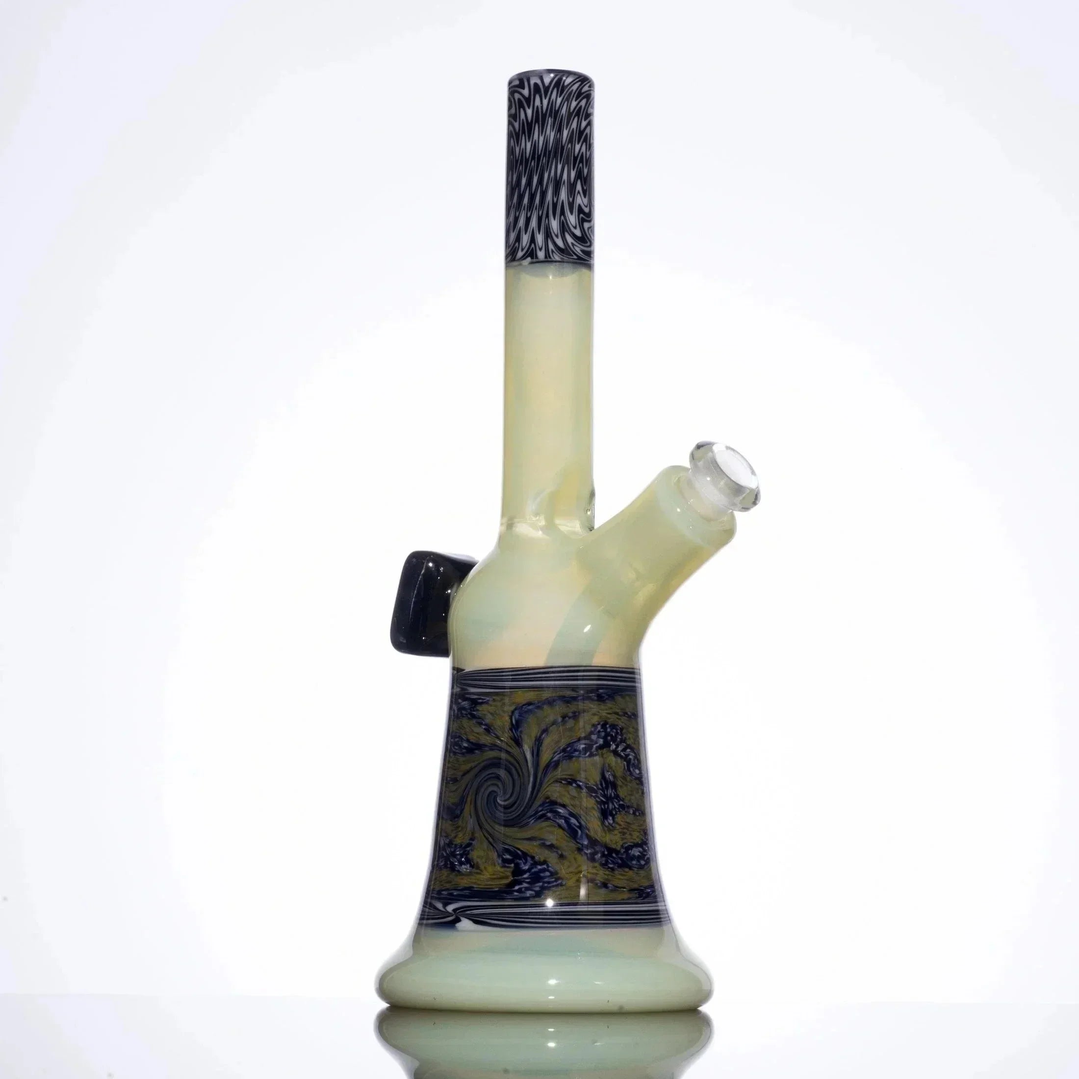 Hand-blown glass bong with swirl patterns, black accents, and yellow-green base on white background