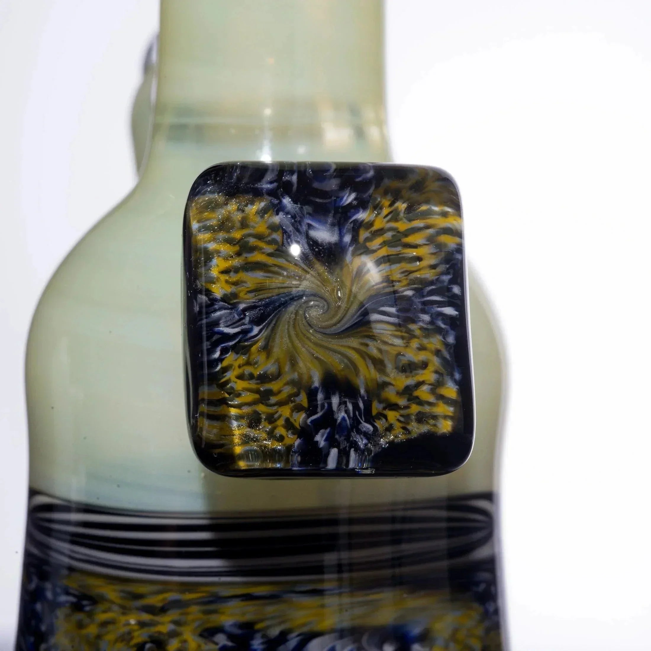 Handblown glass pipe with swirling blue and gold fumed design, premium heady glass accessory
