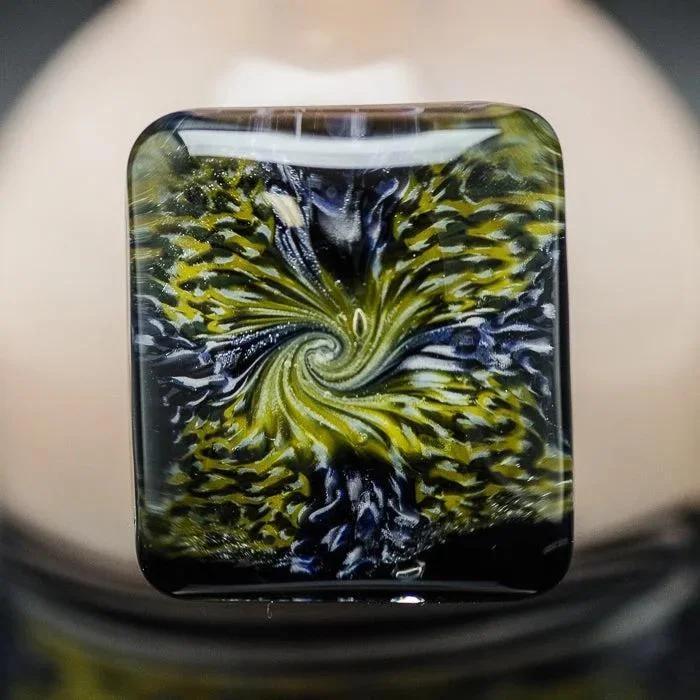 Swirling green and black heady glass pipe bowl with intricate vortex design