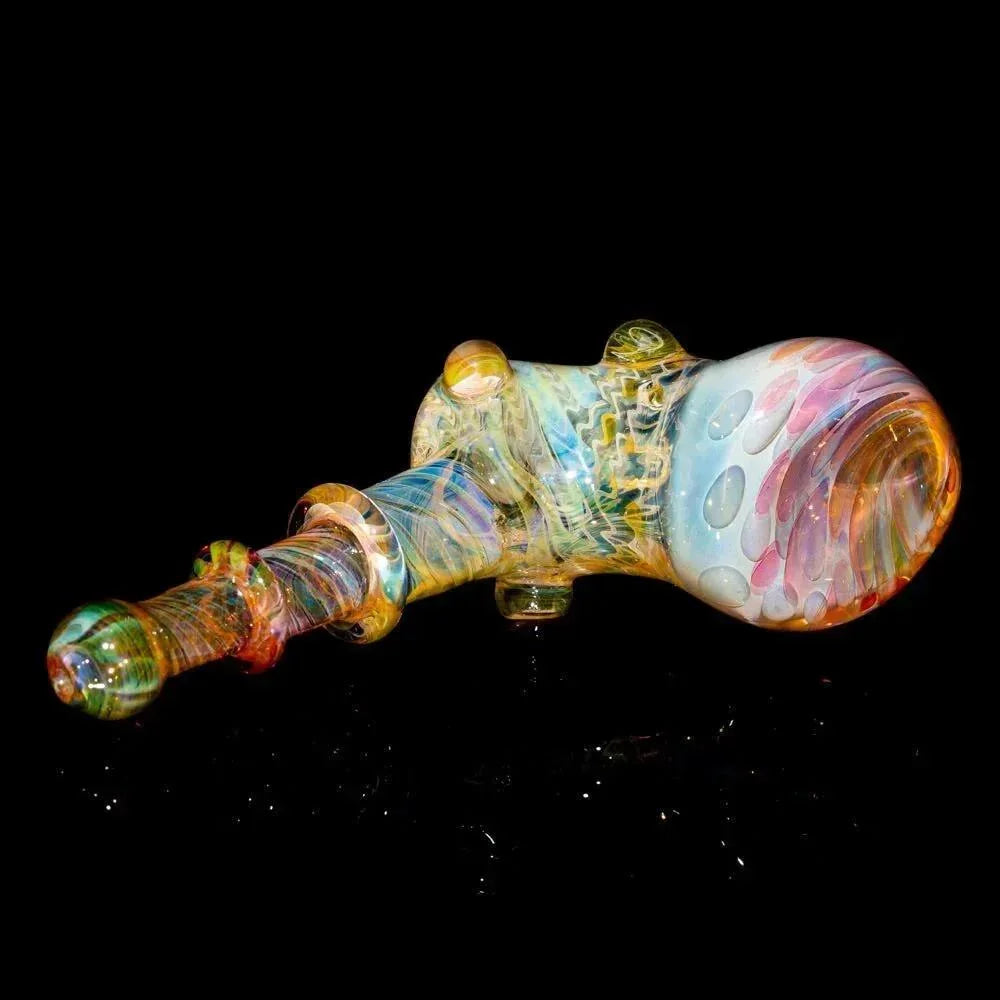 Colorful handblown glass fume hammer pipe with swirled patterns on black background
