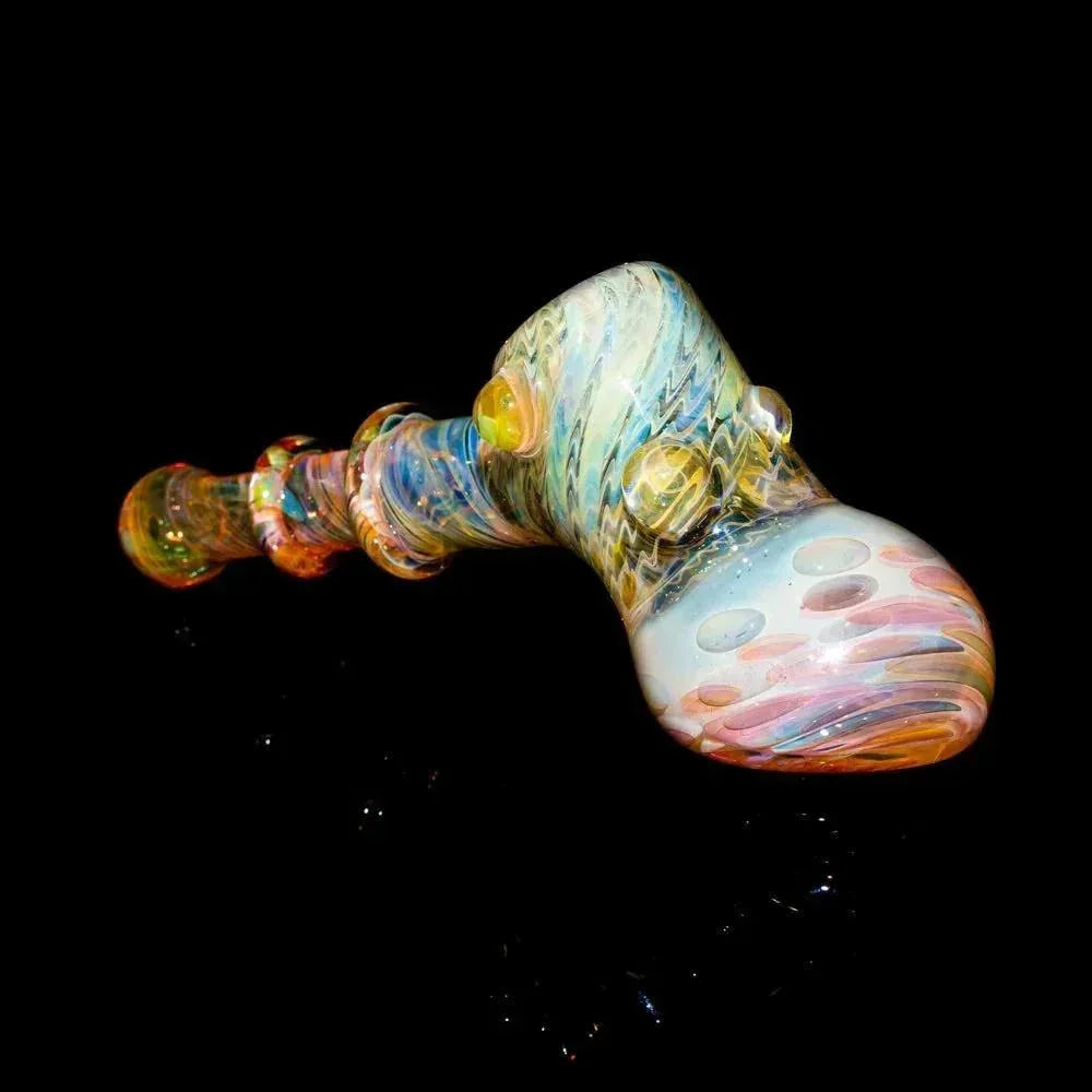 Colorful hand-blown glass fume hammer pipe with marbles and intricate patterns on black background.