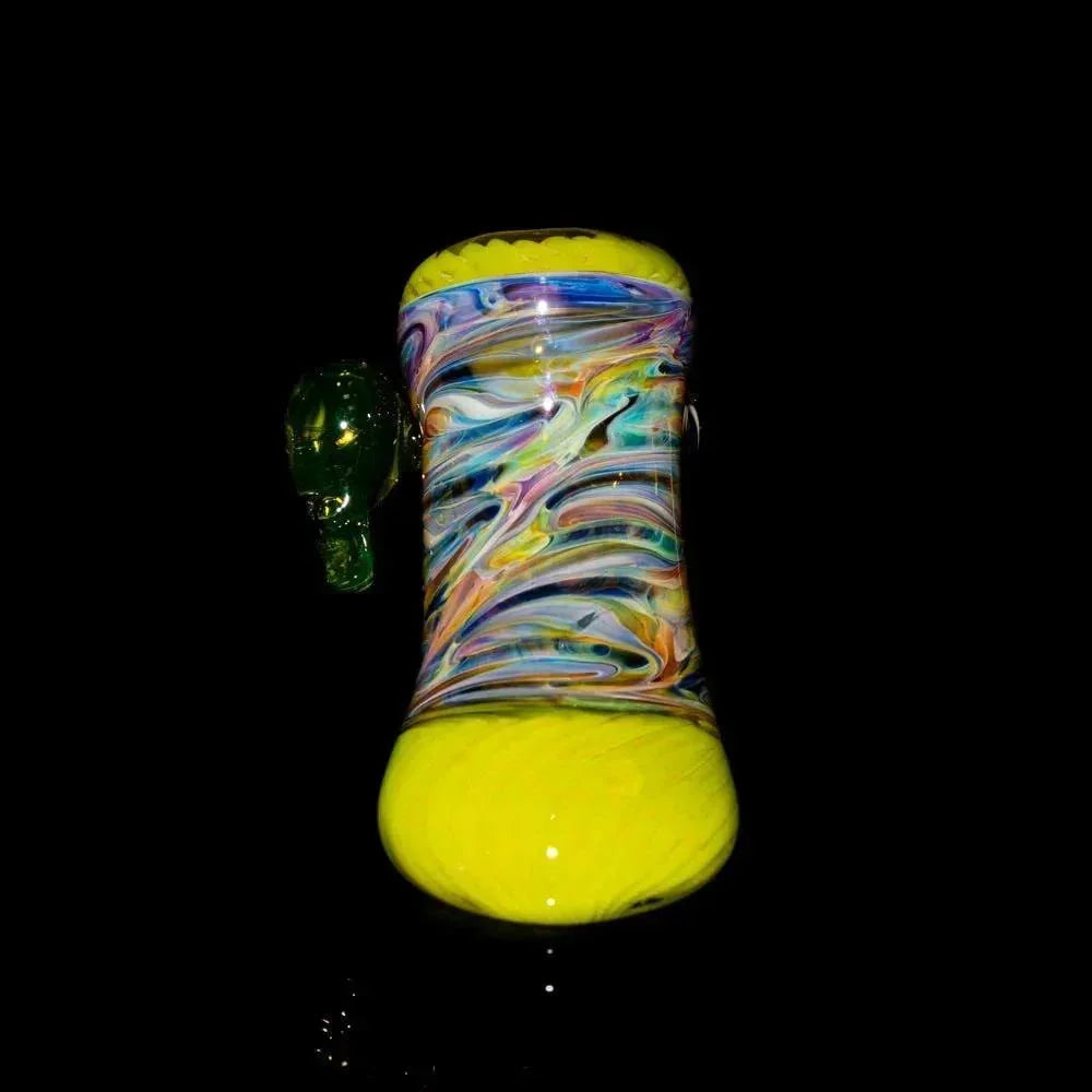 Colorful glass hammer pipe with yellow base and swirling multicolor patterns on black background