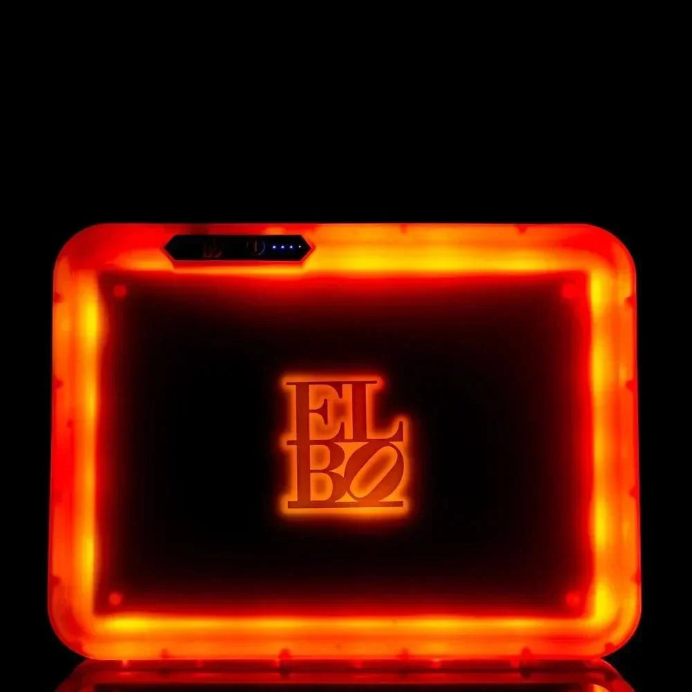 Glowing orange ELBO vaporizer with illuminated logo, sleek design, and LED indicators on black background