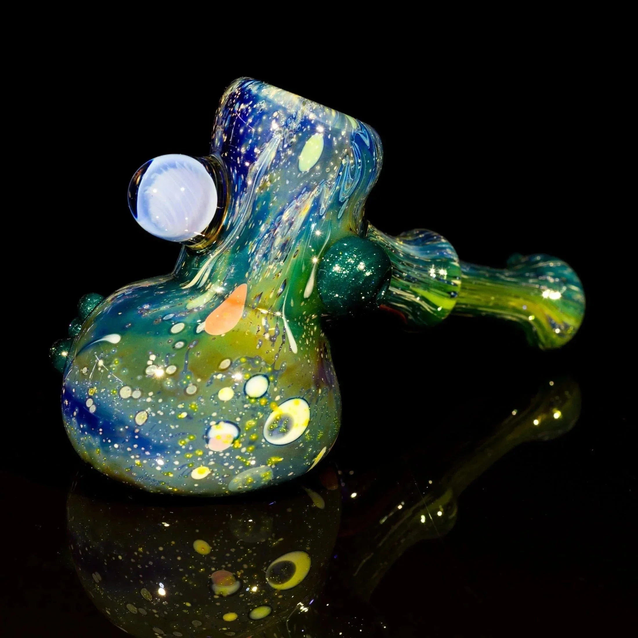 Colorful galaxy-themed glass pipe with swirls and bubbles, perfect for heady glass collectors.