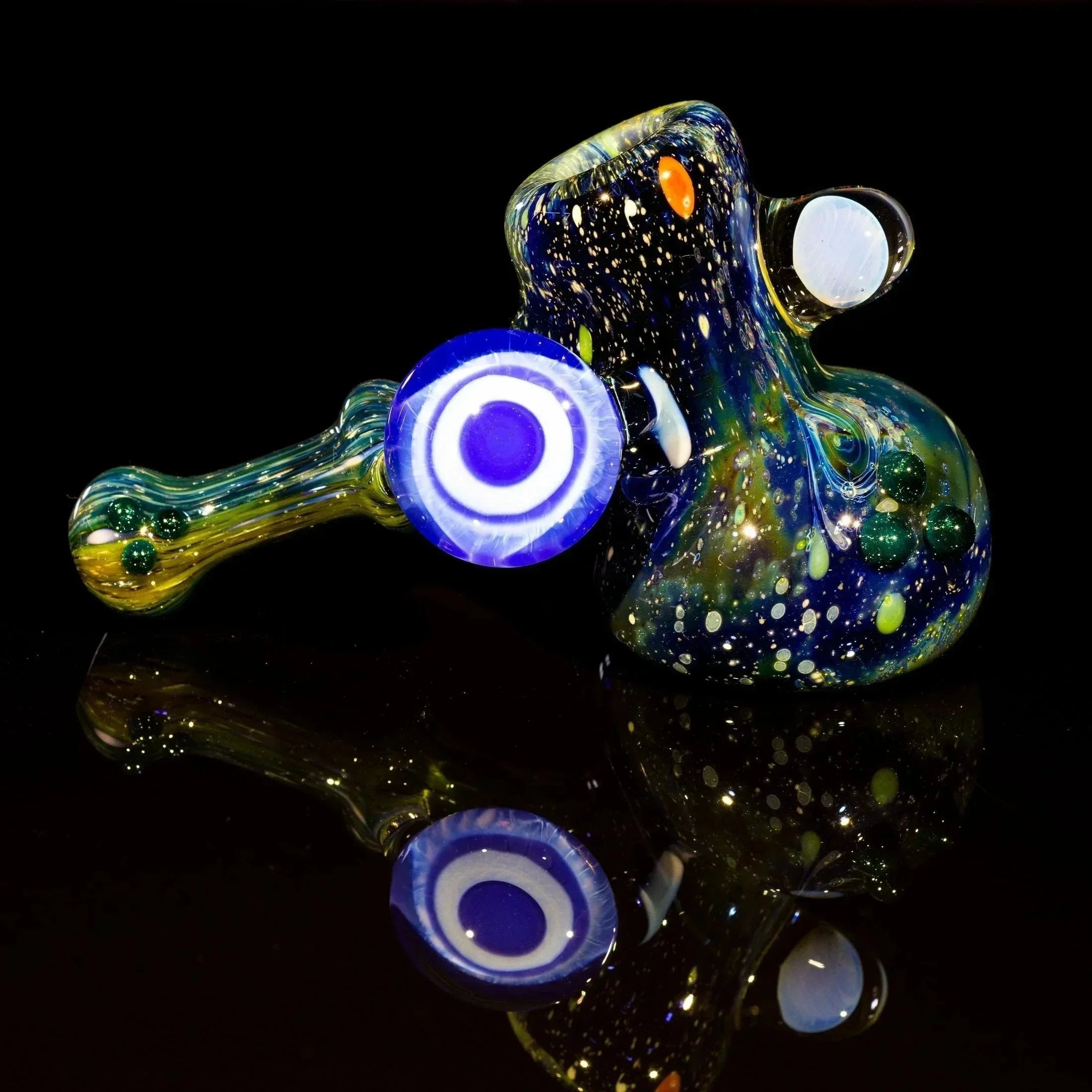 Colorful galaxy-themed glass pipe with swirls and embedded beads, ideal for heady glass collectors.