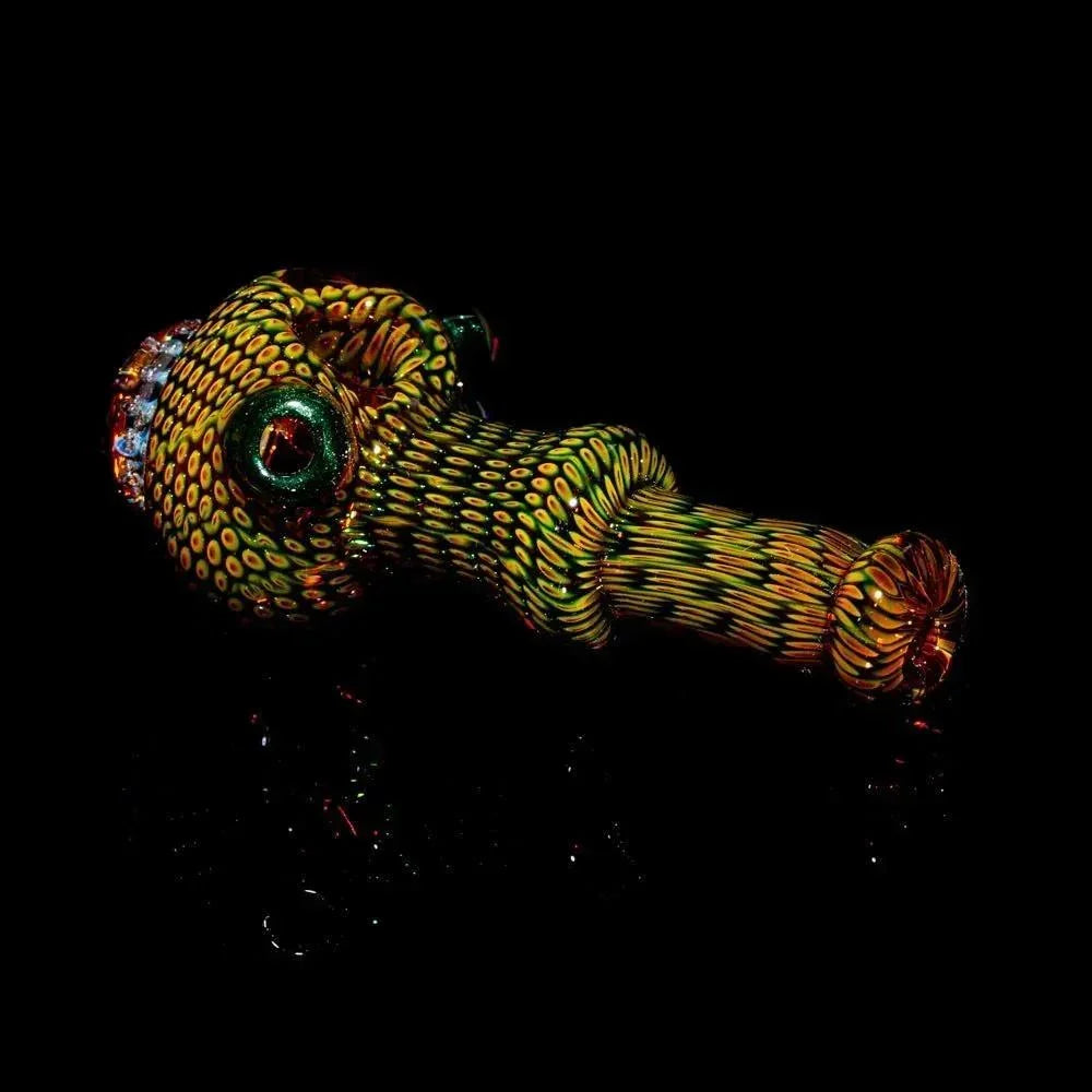 Colorful anemone-patterned glass spoon pipe on a black background, hand-blown art piece