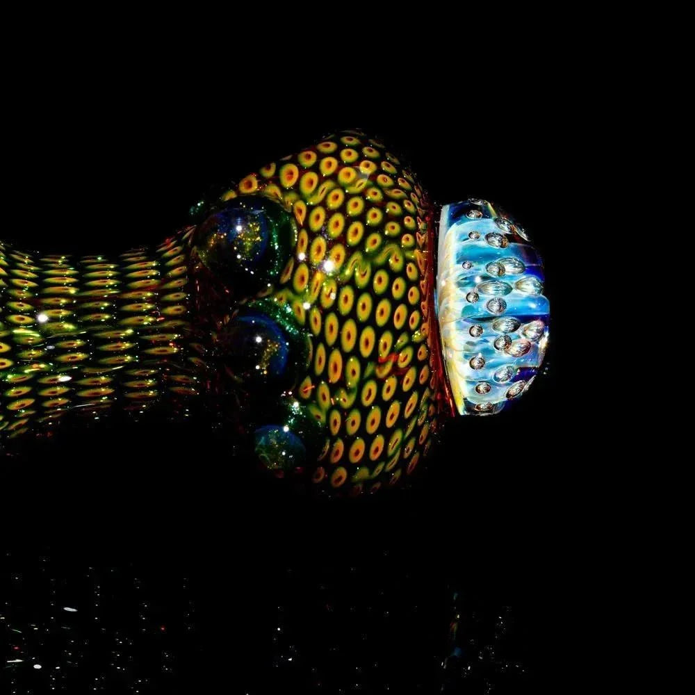 Colorful glass hand pipe with intricate yellow and green spotted pattern, anemone-like design