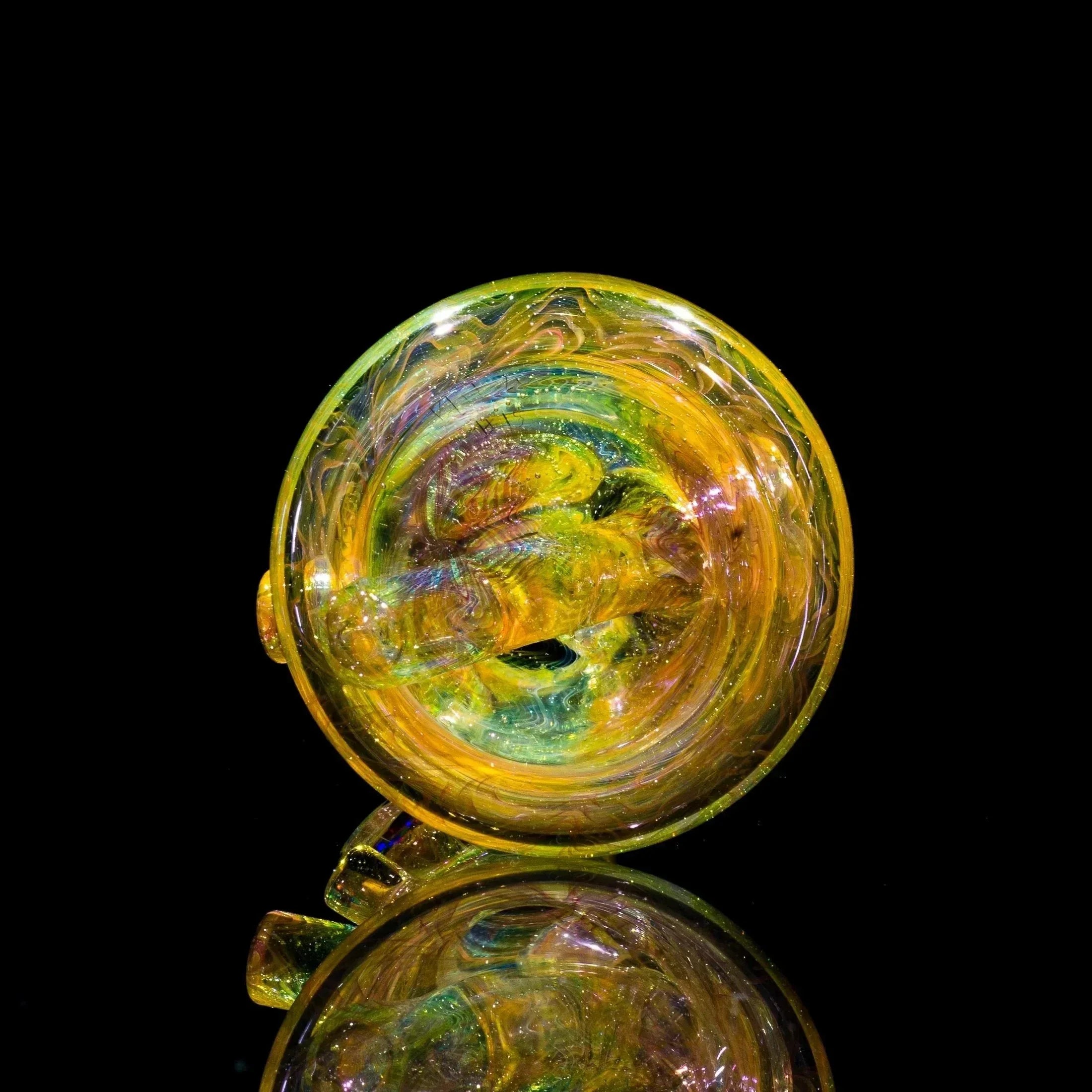 Vibrant heady glass pipe with swirling yellow, green, and iridescent colors on black background
