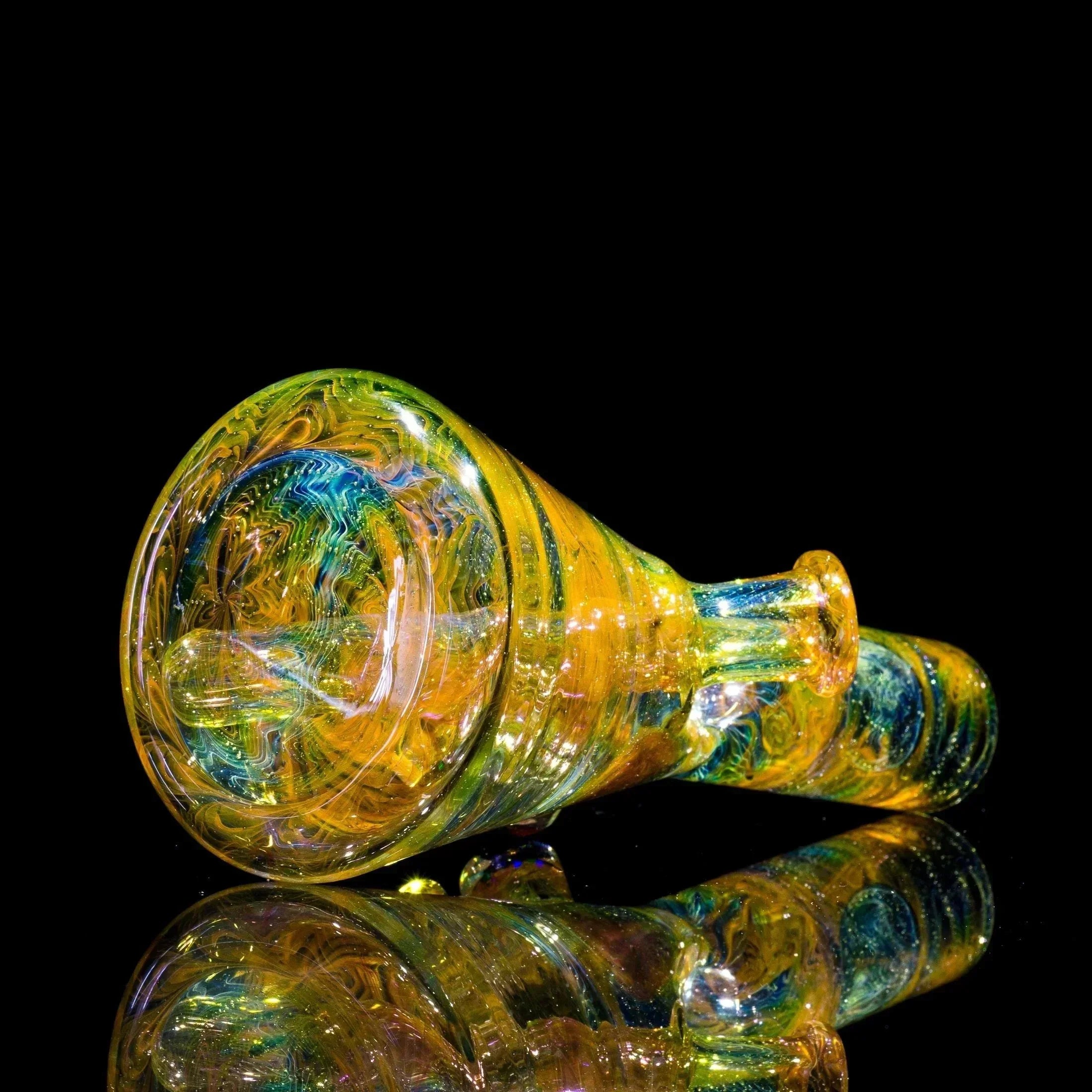 Vibrant yellow and blue swirl glass pipe with reflective surface, showcasing heady glass artistry.