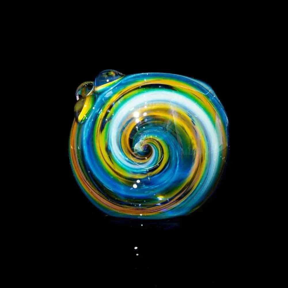 Blue and yellow fumed glass spoon pipe with spiral design on black background