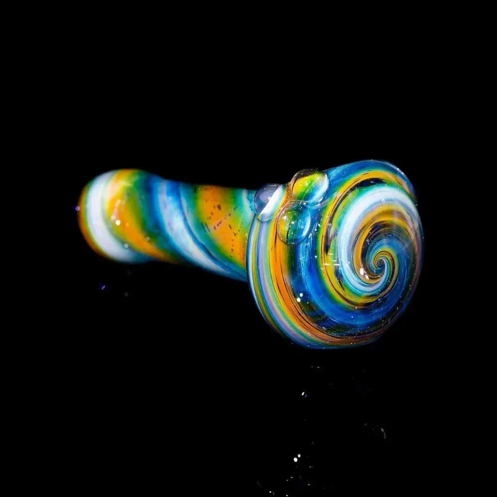 Colorful blue and yellow glass hand pipe with spiral design on a black background.