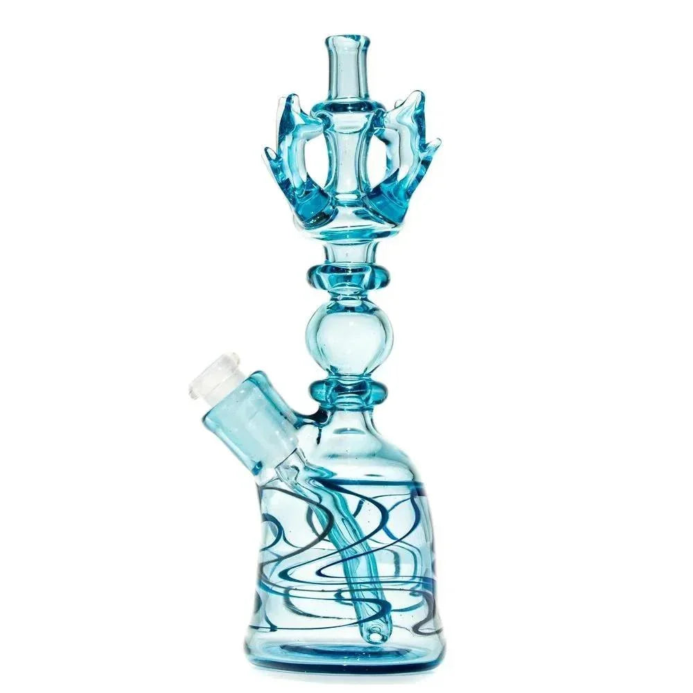Blue glass water pipe with intricate swirl accents and decorative top chamber, studio background