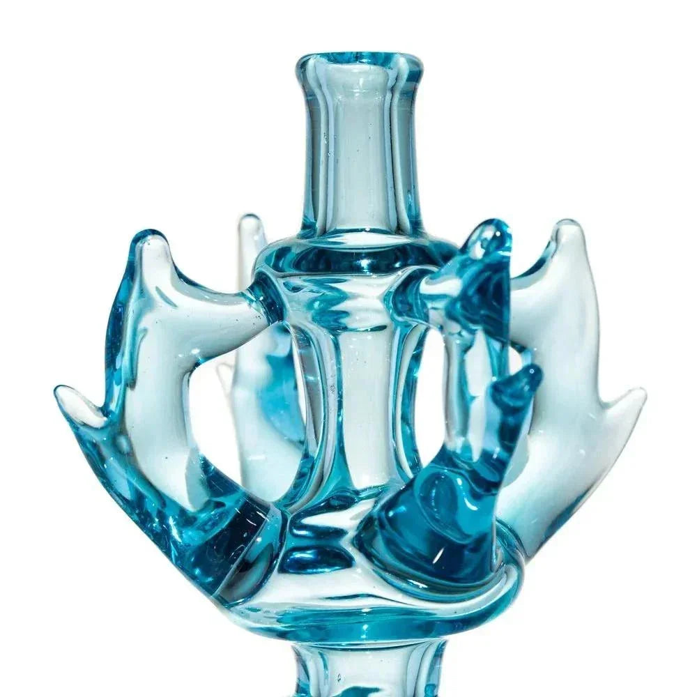 Blue glass art pipe with intricate droplet and wave designs, close-up view