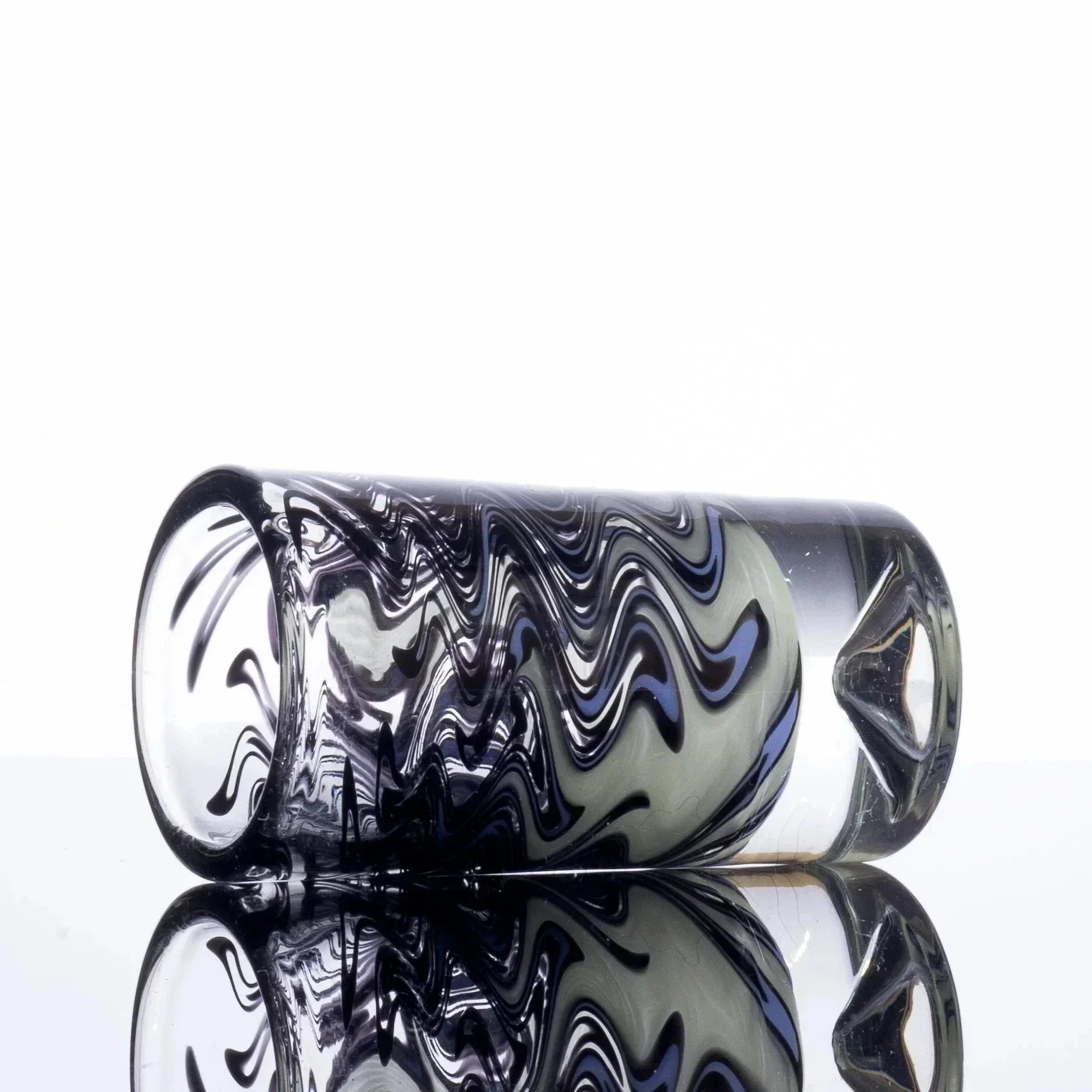 Swirled black and blue glass pipe with reflective surface