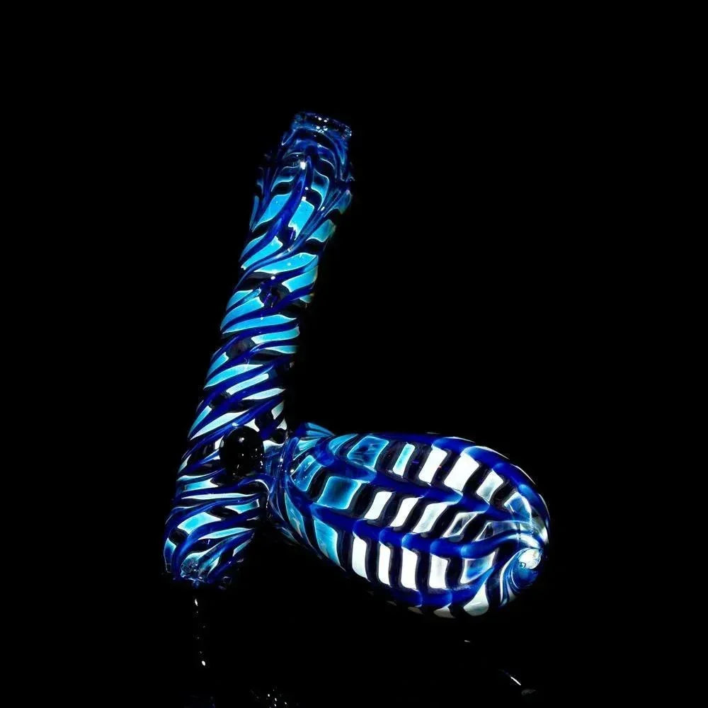 Hand-blown blue and white glass pipe with twisted stripe design on black background