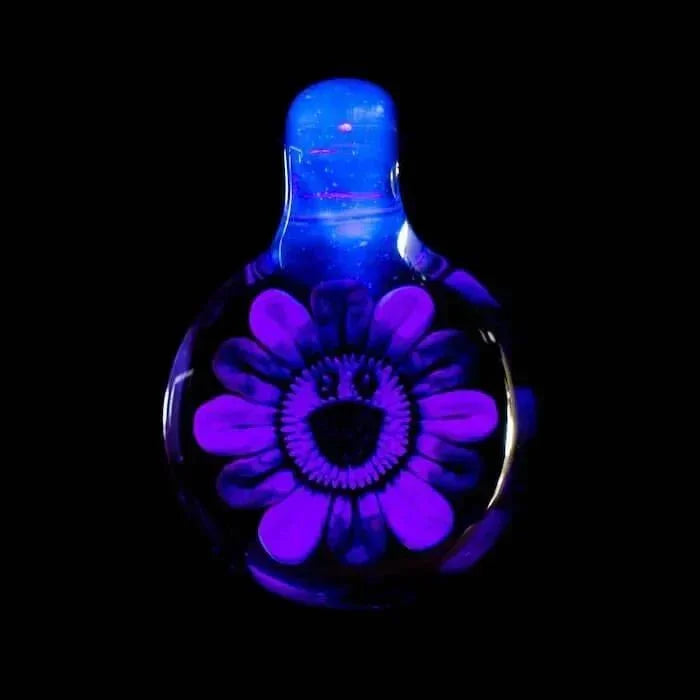 Vibrant blue glass pipe with glowing purple flower design, heady glass art for collectors