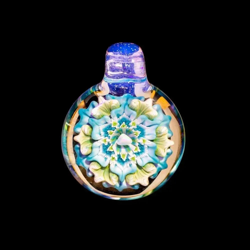 Handcrafted glass pendant featuring opal flower design with blue and green accents on black background.