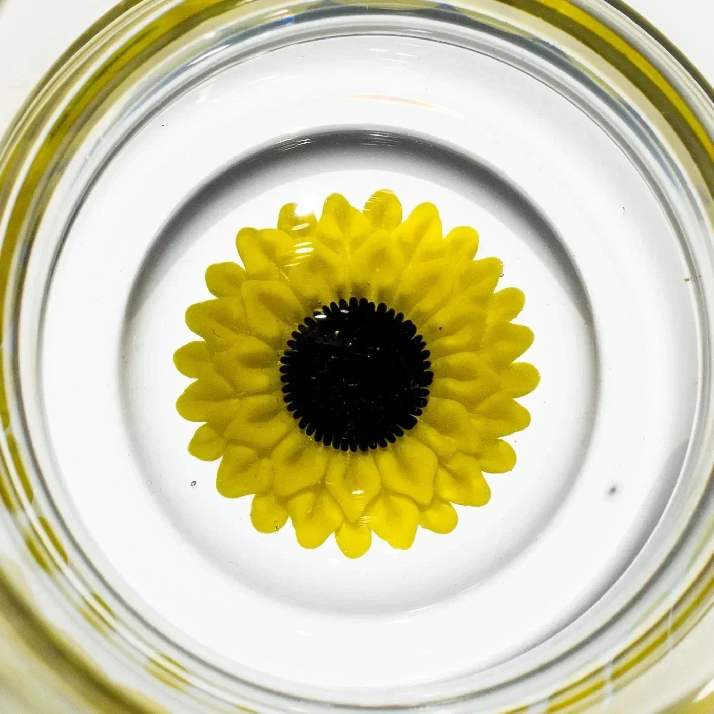 Yellow flower design in clear glass pipe bowl