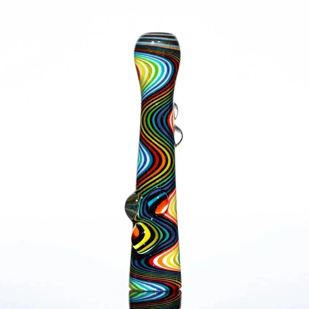 Colorful rainbow wig wag glass pipe with black accents on white background