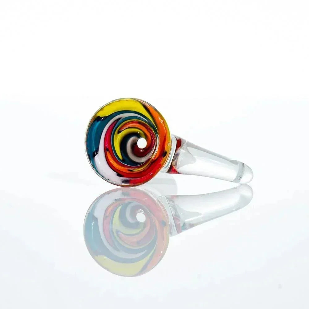 Colorful glass bowl piece with wig wag swirl design and clear joint on white background