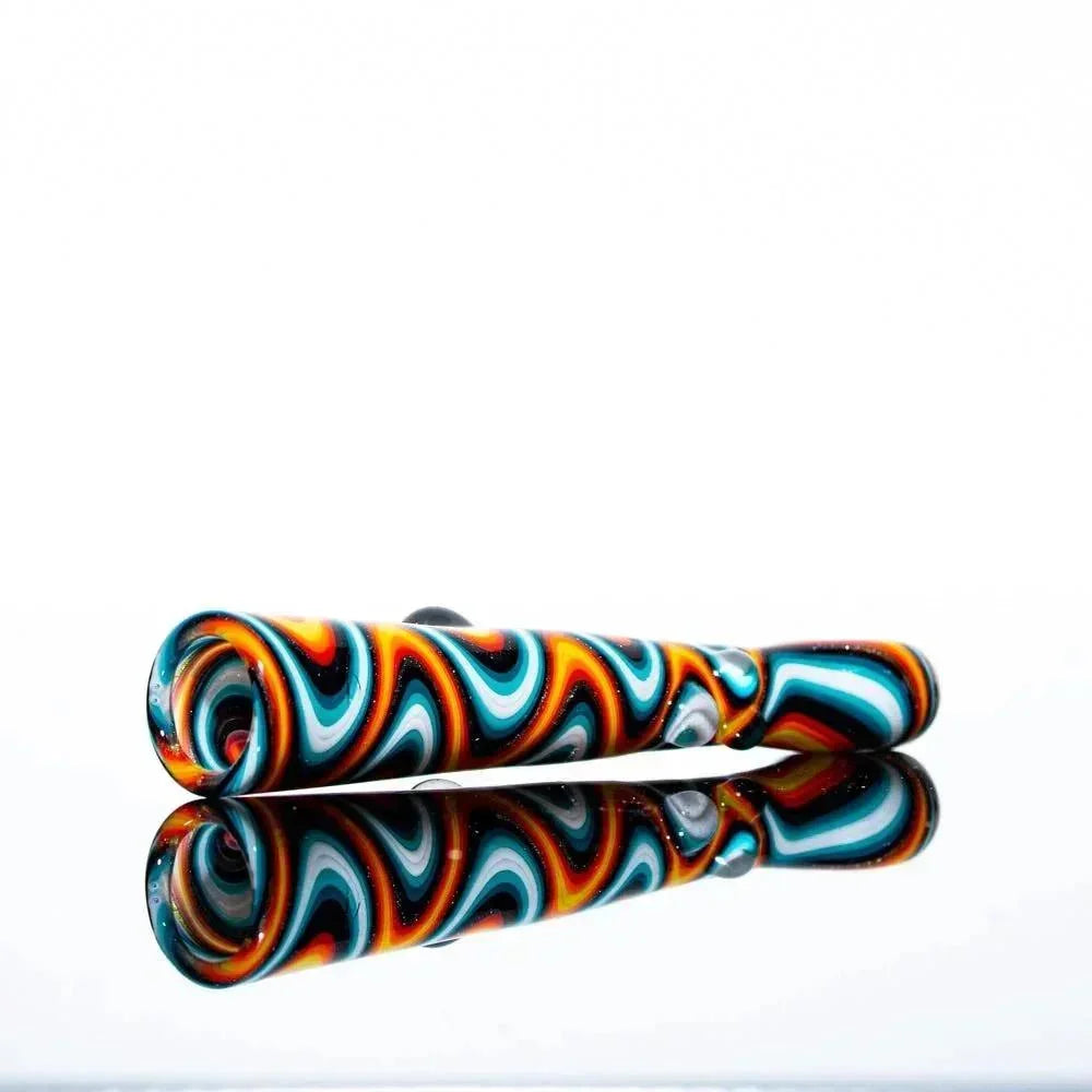 Colorful hand-blown glass one hitter pipe with fire and ice wig wag pattern on white background