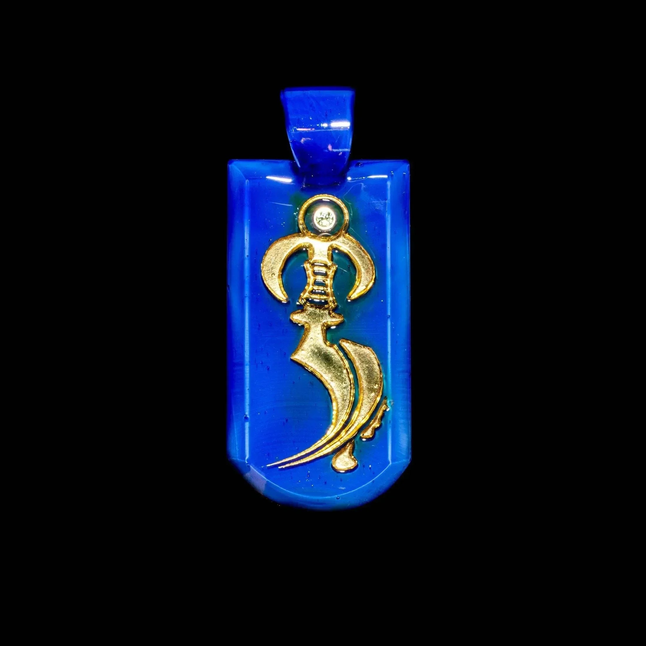 Blue glass pendant with gold dagger and peridot gemstone detail on black background