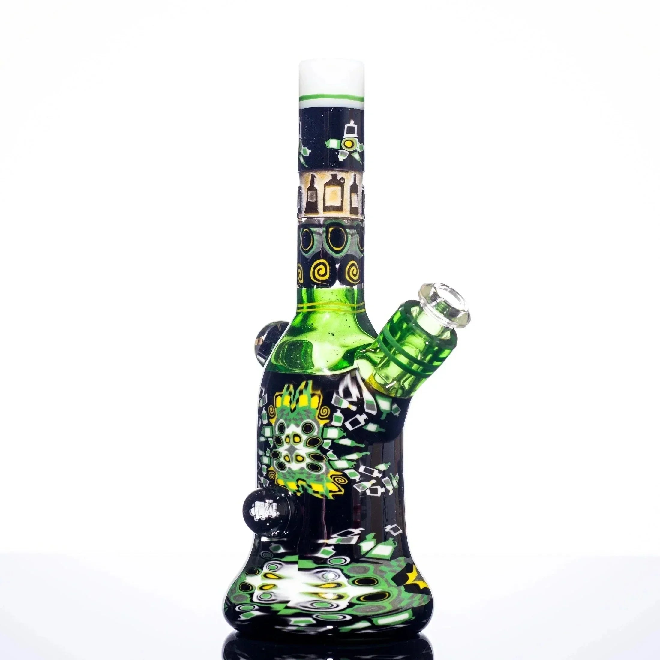 Green and black heady glass bong with intricate swirls and bottle designs, featuring a beaker base and angled neck.