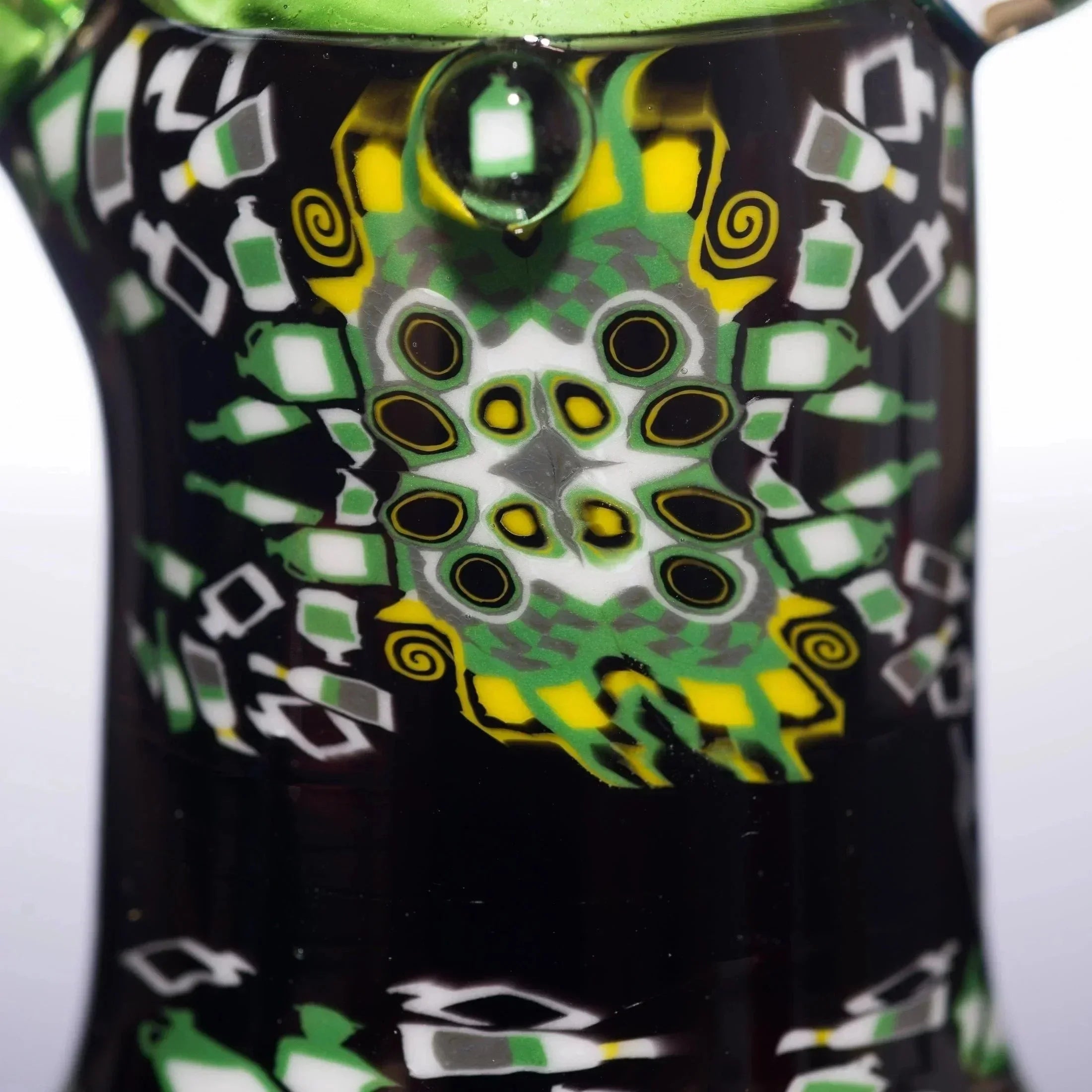 Vibrant green, yellow, and black heady glass pipe with intricate bottle and spiral patterns, showcasing detailed craftsmanship.