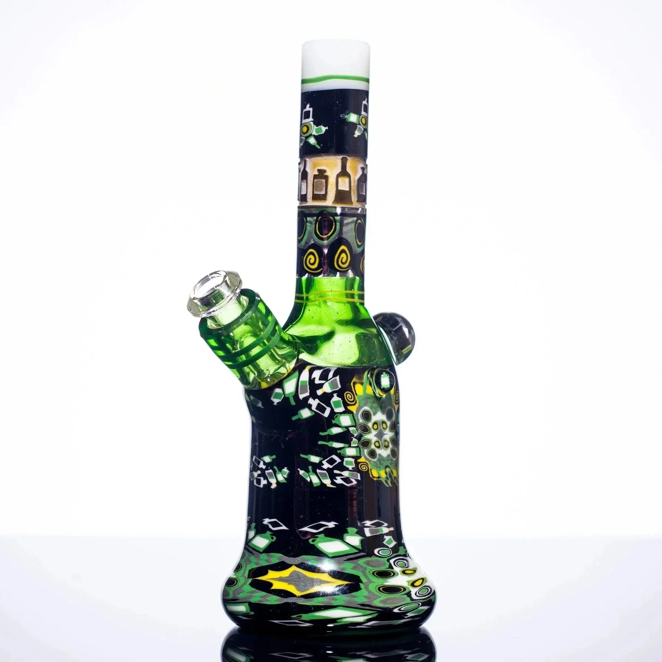 Vibrant green and black heady glass bong with intricate bottle and swirl designs, studio shot