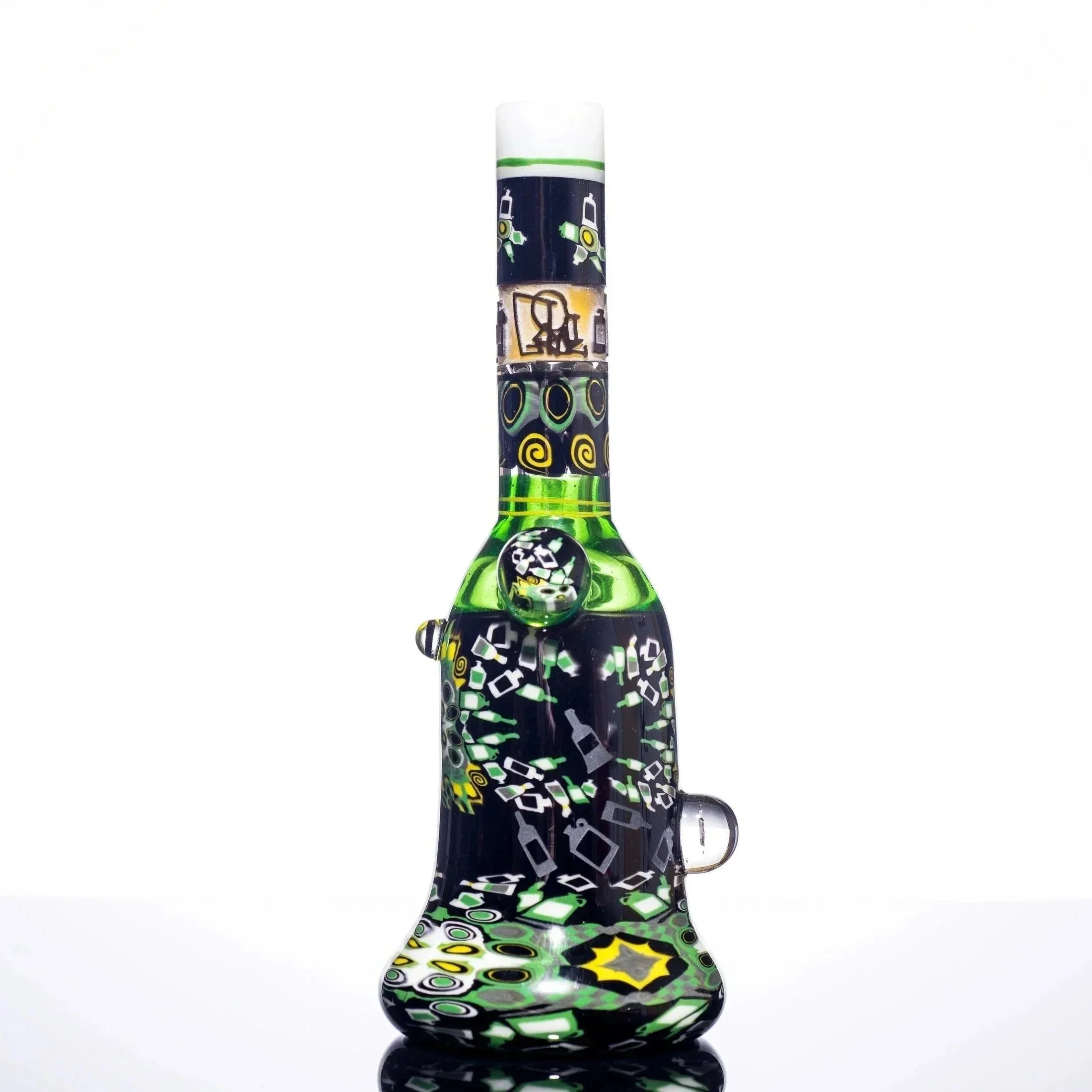 Colorful green and black glass bong with intricate patterns and bottle designs, heady glass art piece