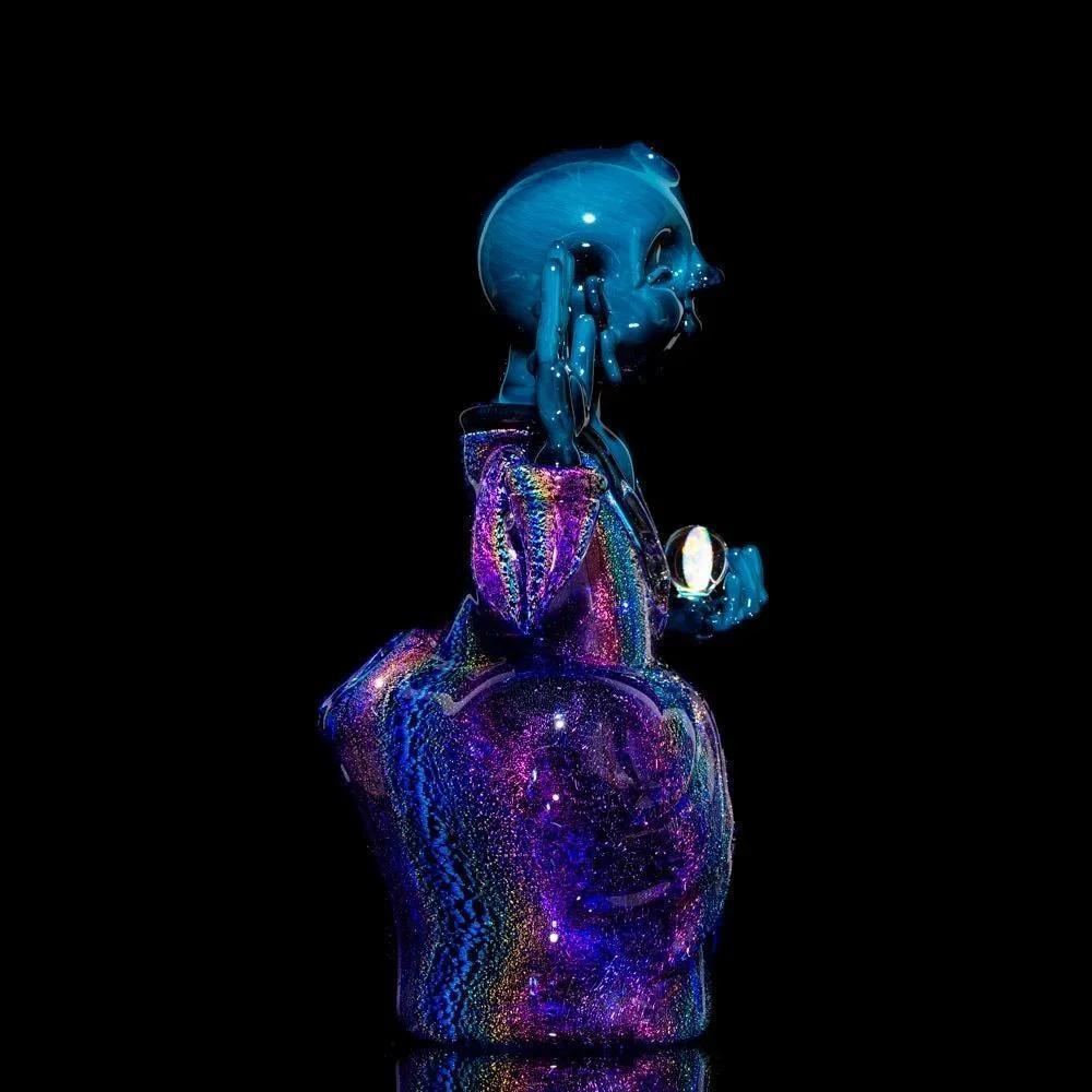 Colorful glass Buddha pipe with iridescent finish and unique artistic details on black background