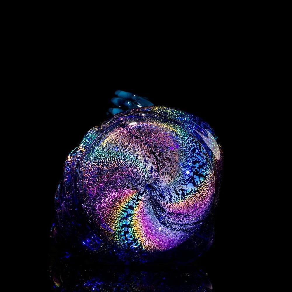 Iridescent hand-blown glass pipe with swirling rainbow colors on a black background