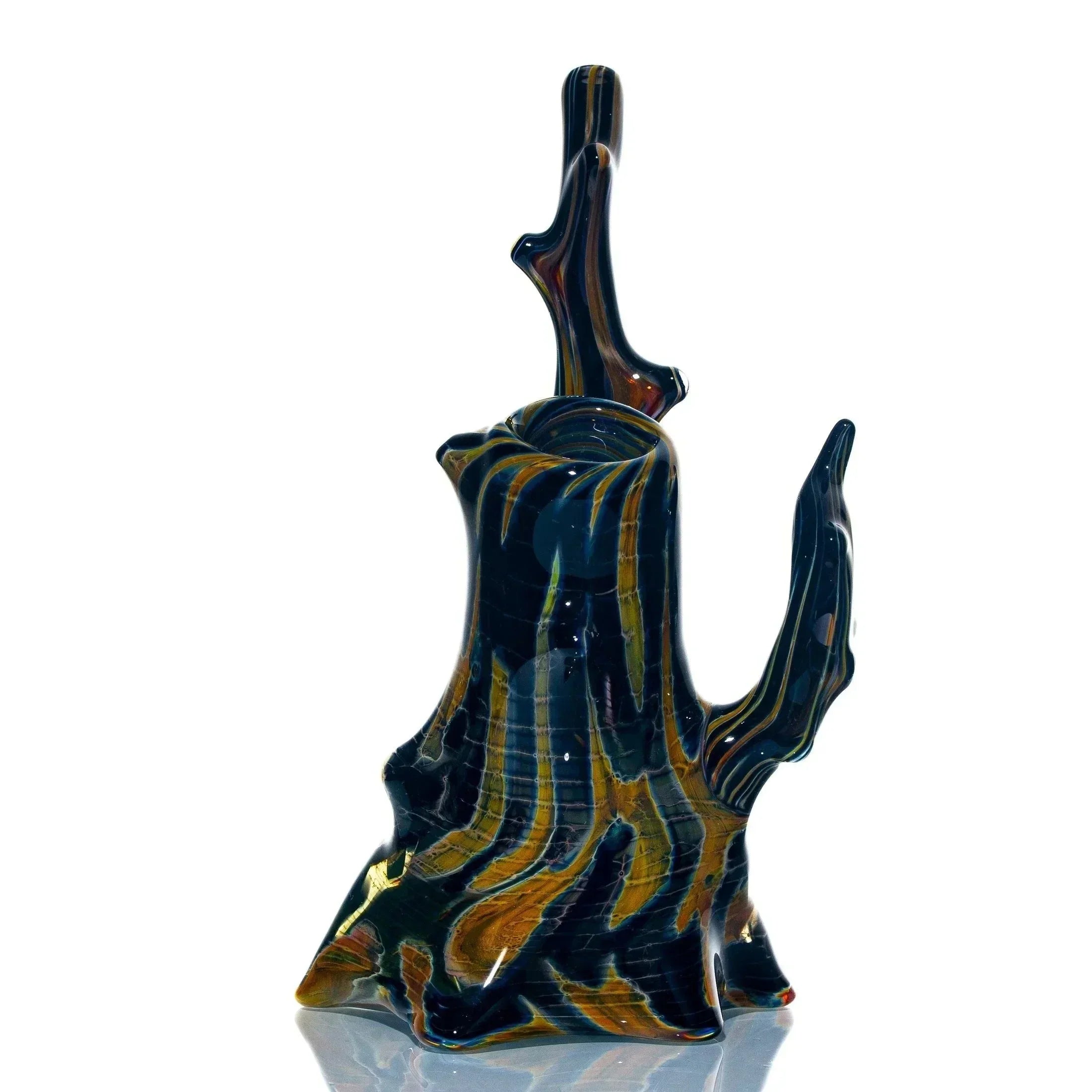 Artistic glass bubbler shaped like a burnt tree stump with swirled dark and amber colors