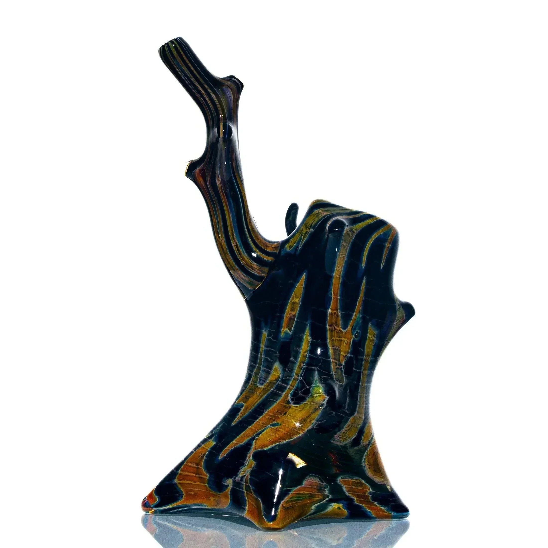 Colorful glass bubbler shaped like a tree stump with branch, hand-blown art pipe