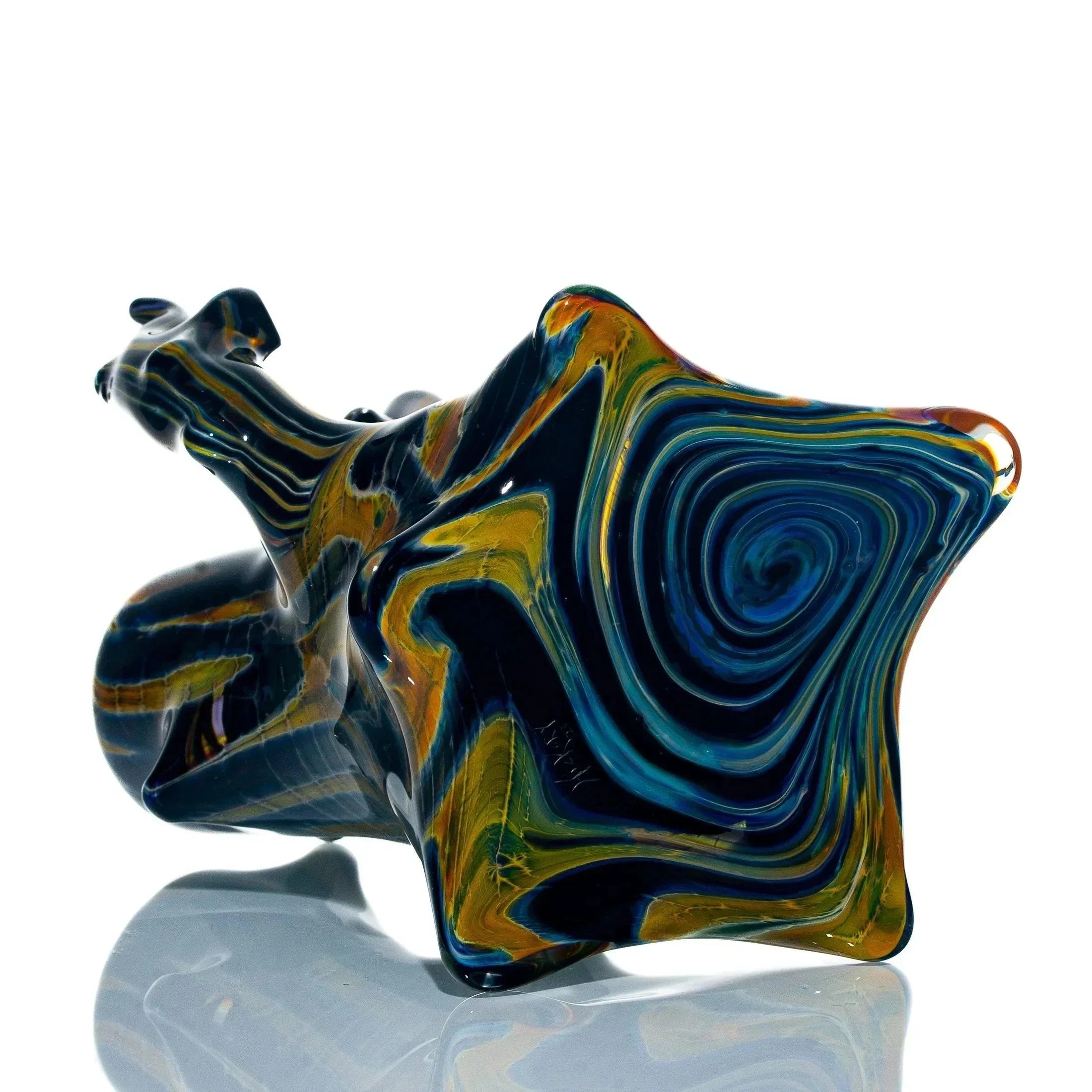Colorful glass bubbler pipe with swirling blue, yellow, and orange patterns on a reflective surface