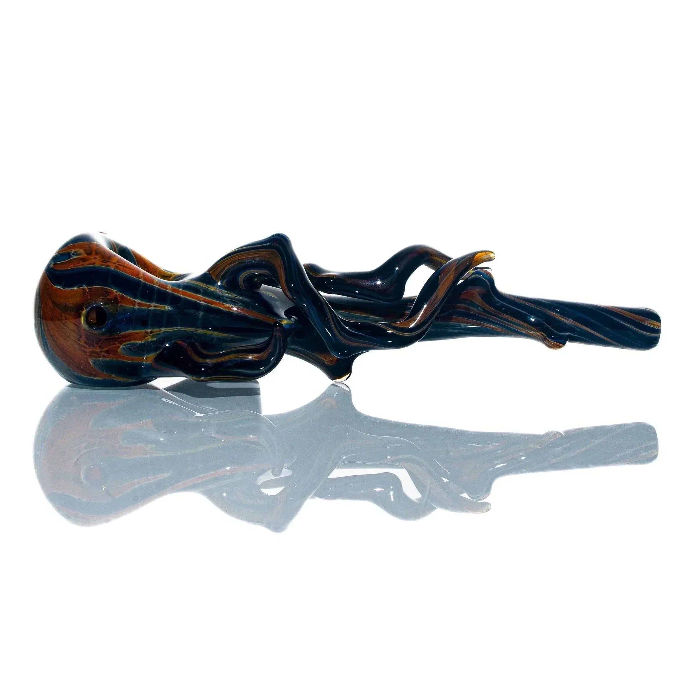 Hand-blown glass spoon pipe with burnt wood and branch design on white background