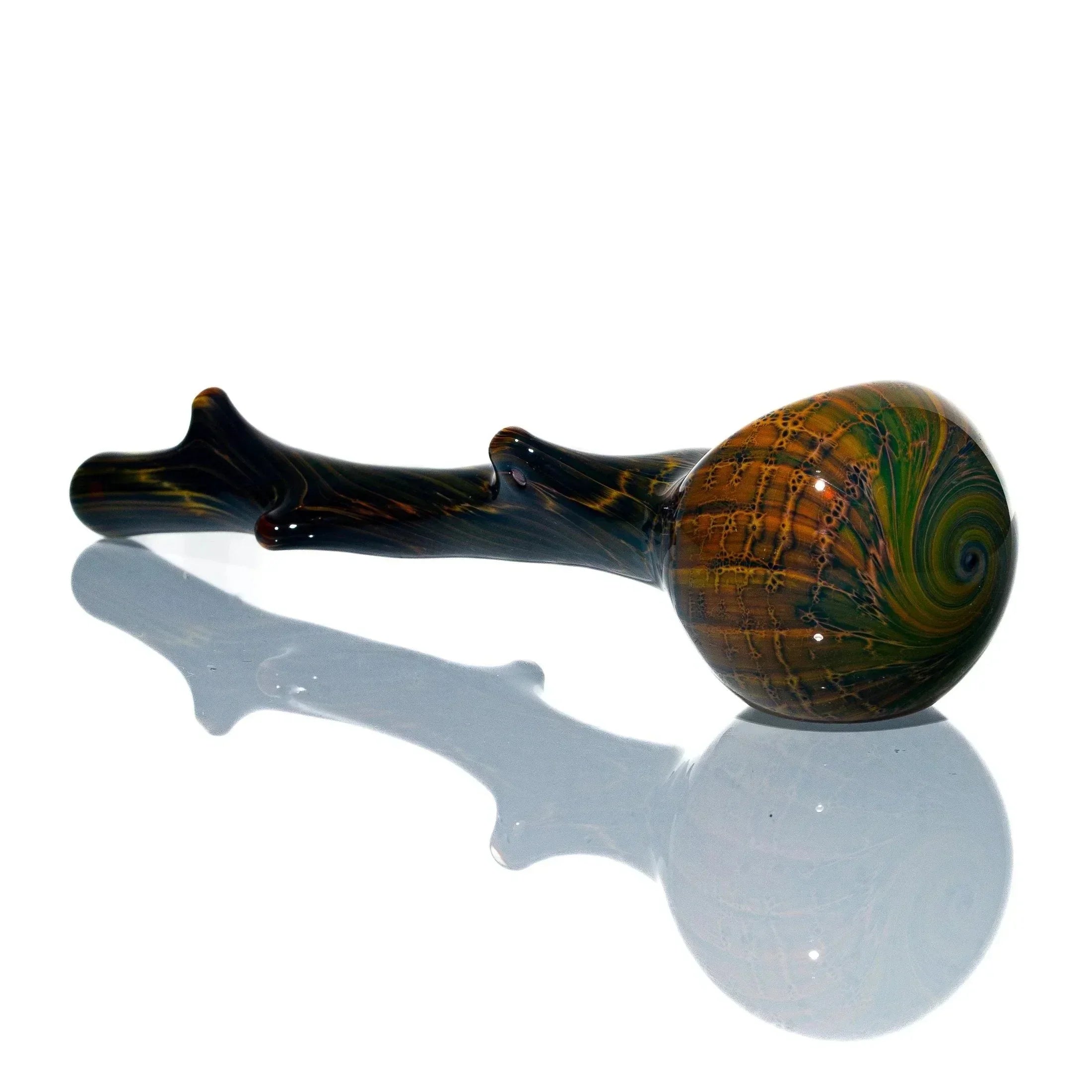 Hand-blown glass spoon pipe shaped like a wood branch with swirl pattern bowl on white background.