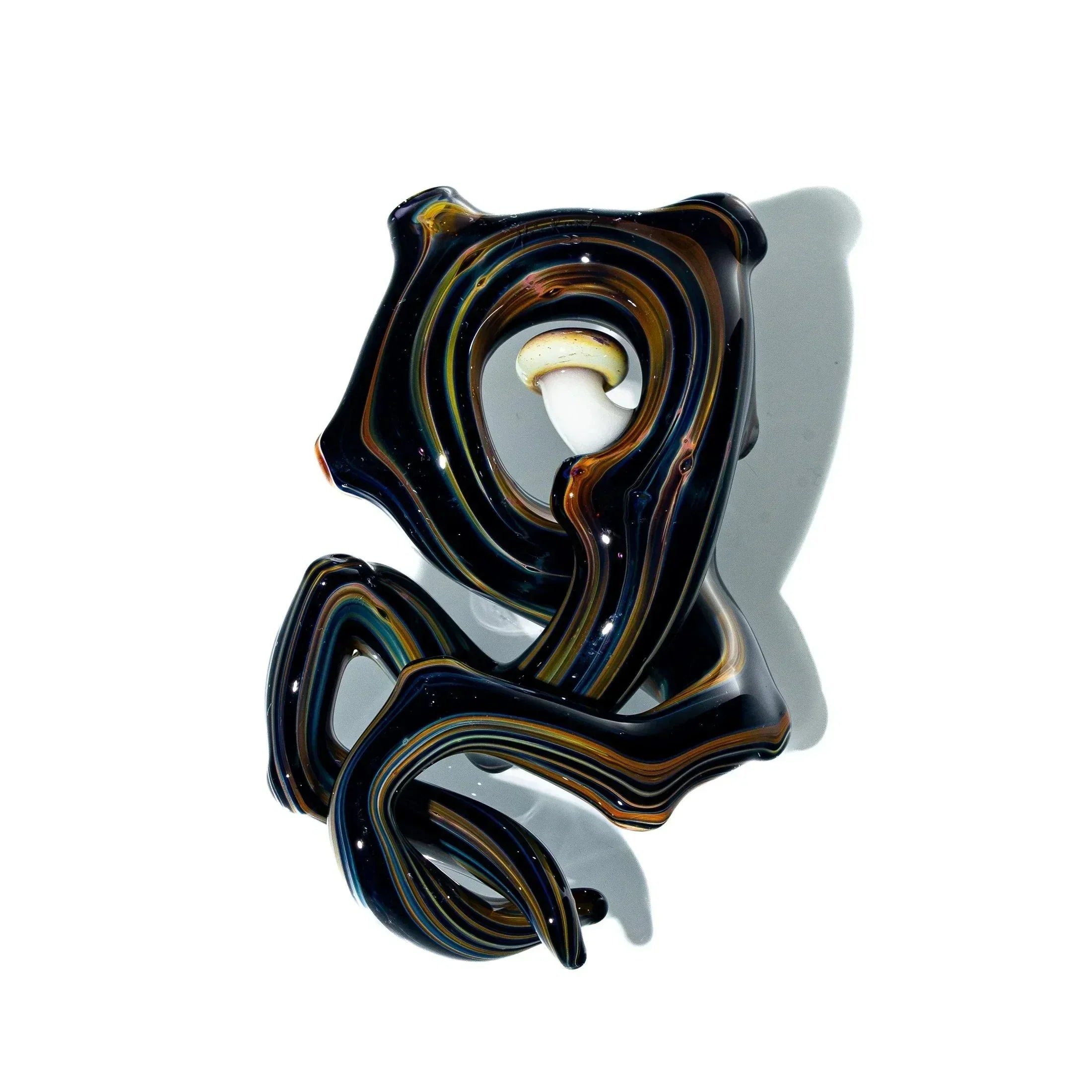 Hand-blown glass pendant with swirling black, brown, and gold patterns and white accent