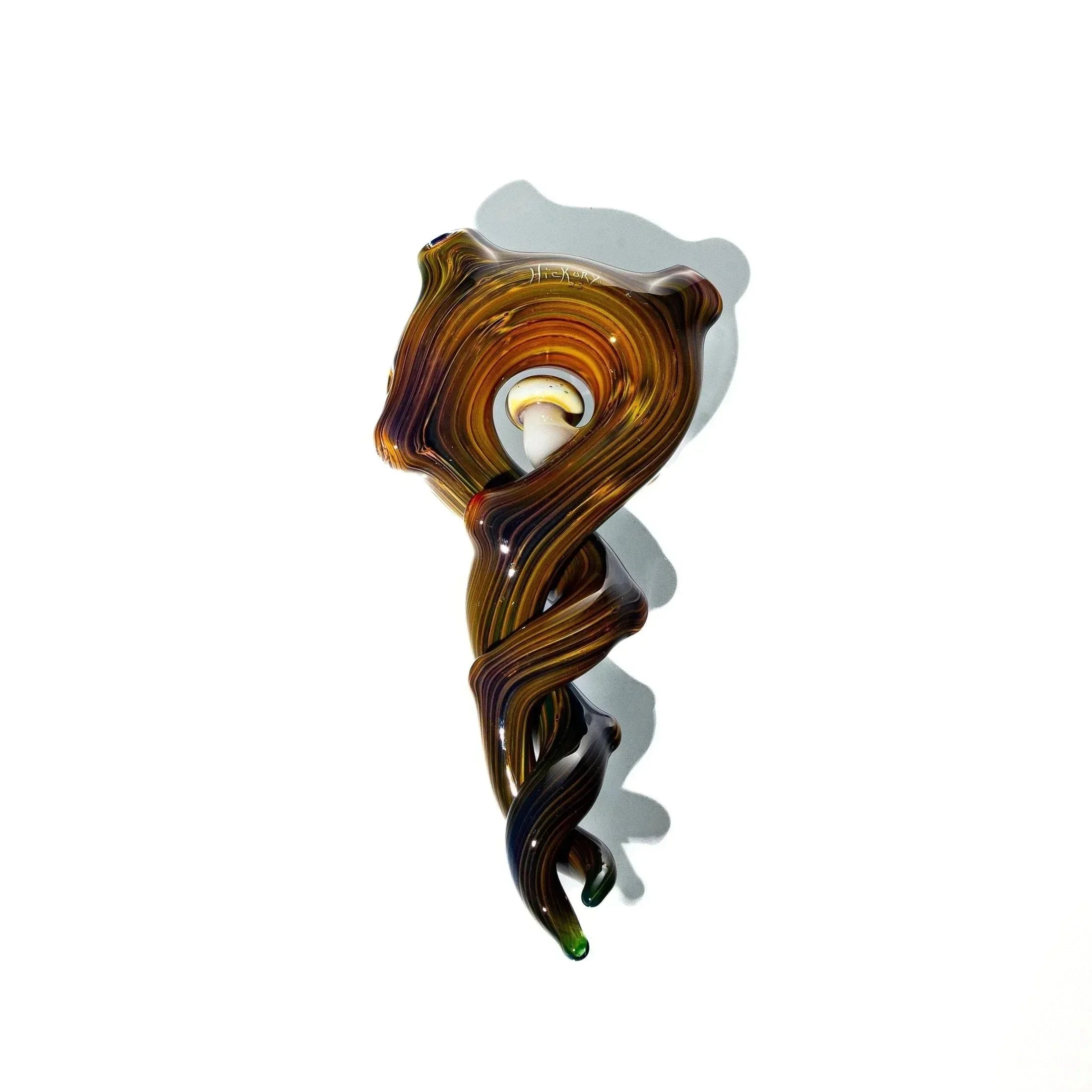 Handcrafted hickory glass pendant with twisted brown design on white background