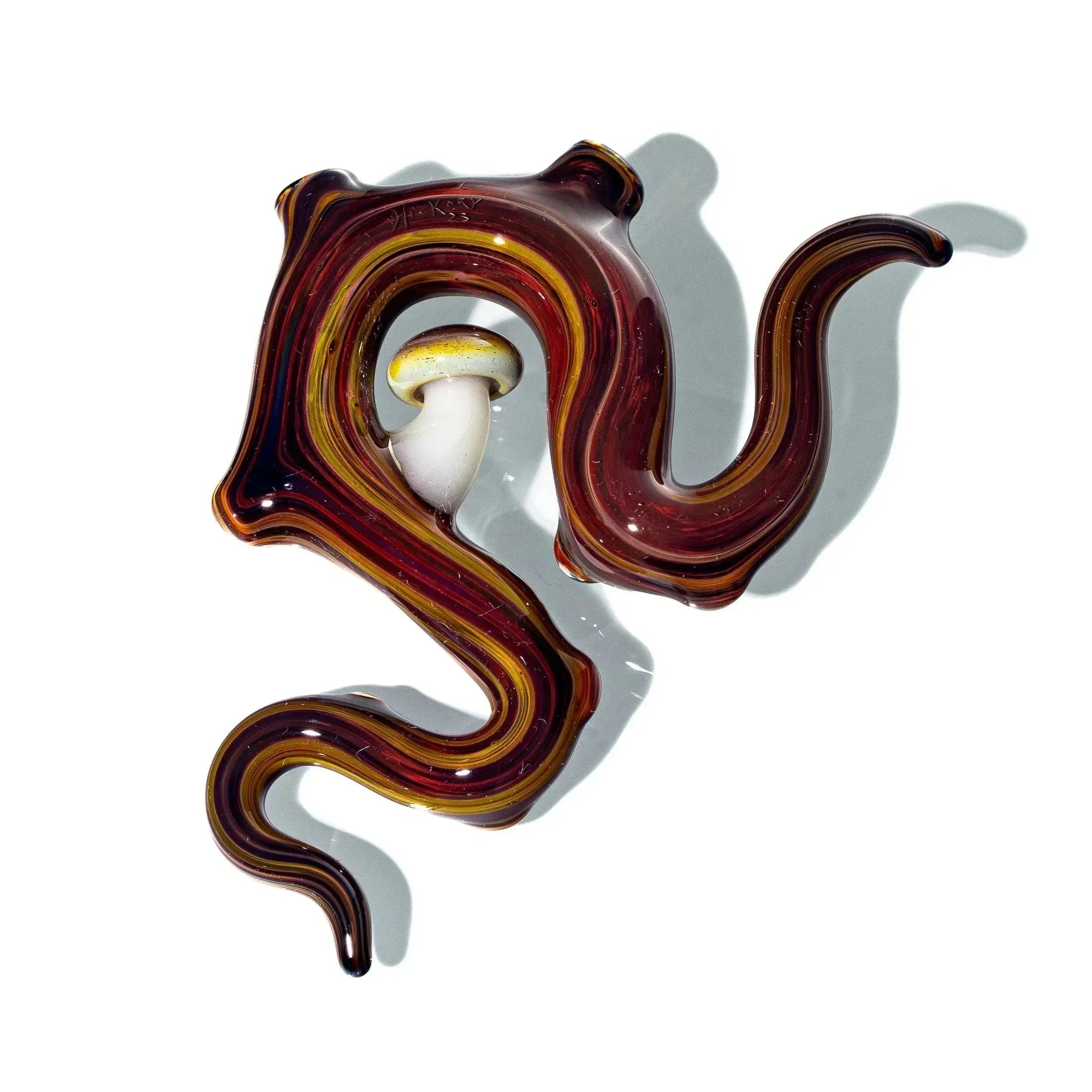 Handmade brown and amber glass pendant with spiral design and mushroom accent on white background