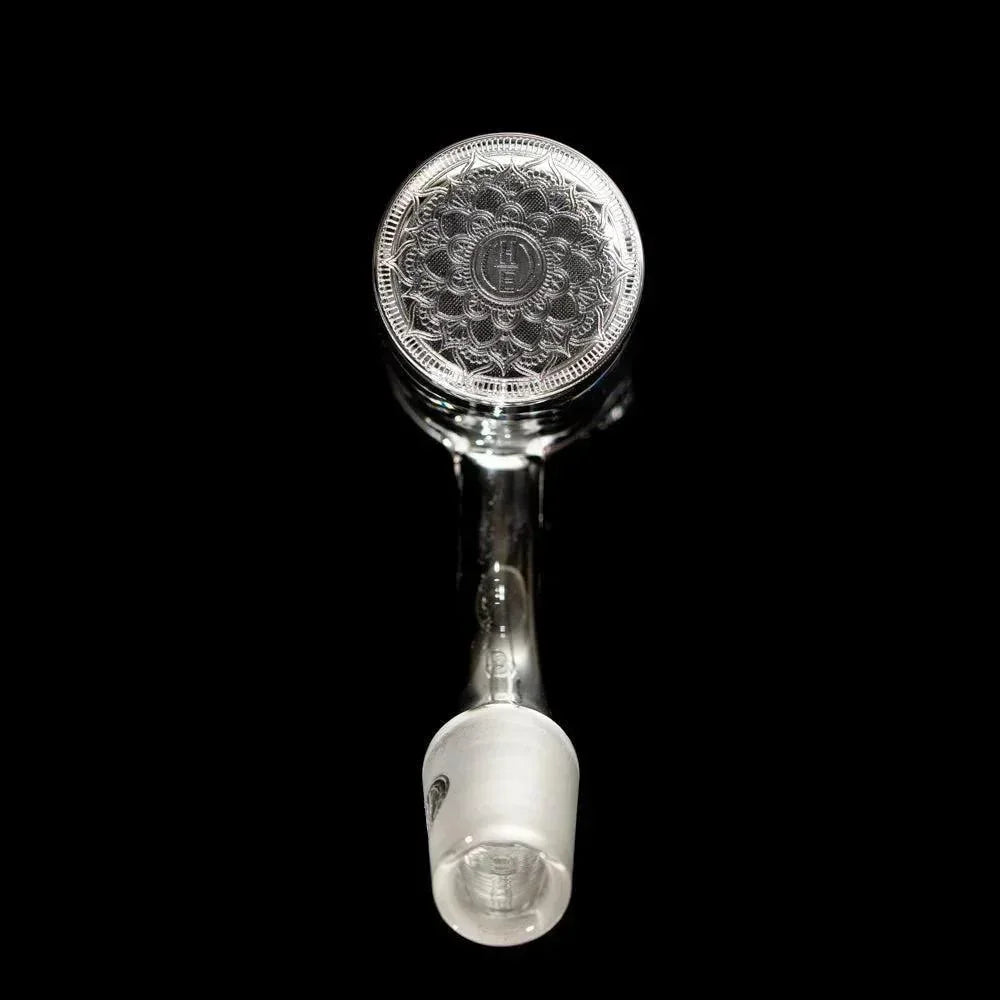 Quartz banger with intricate etched design and frosted joint on black background
