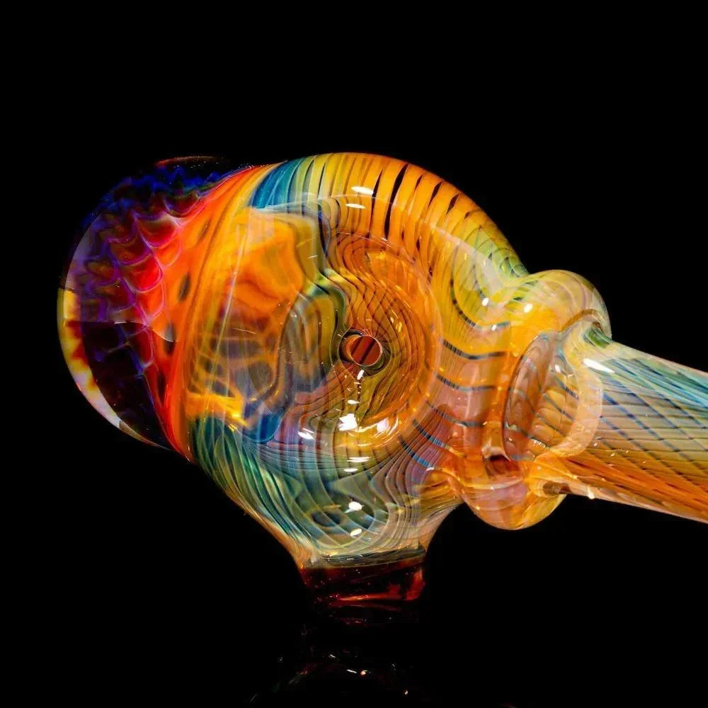 Colorful honeycomb linework glass spoon pipe with rainbow patterns on a black background