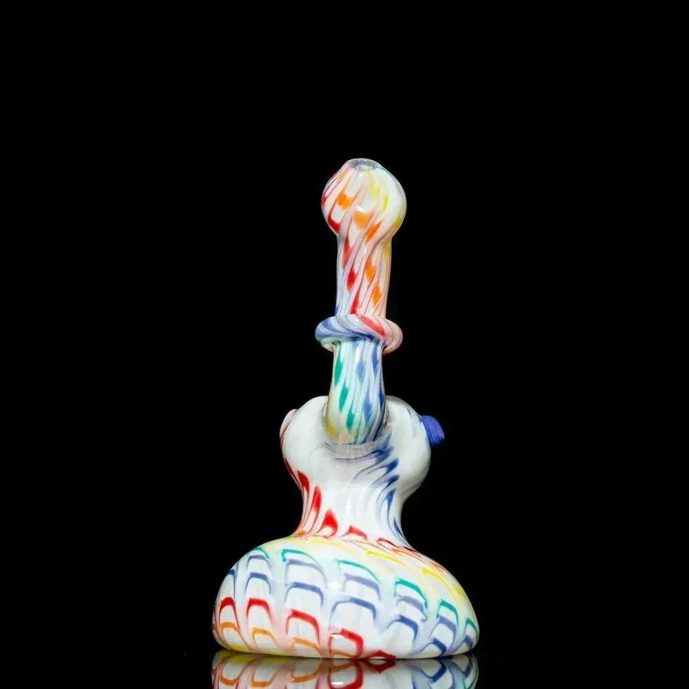 Colorful hand-blown glass pipe with rainbow swirls and textured base, studio shot on black background