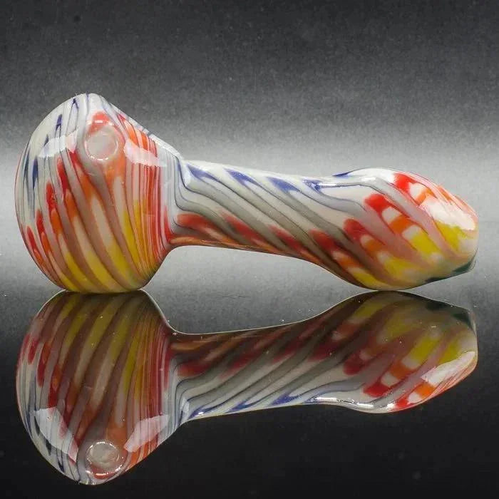 Colorful striped glass pipe with vibrant swirls, ideal for heady glass collectors