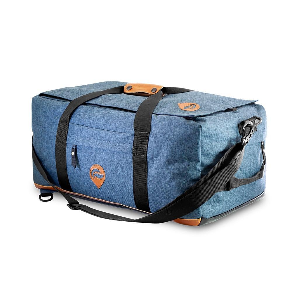Blue denim hybrid duffle bag with black straps and leather accents on a white background.