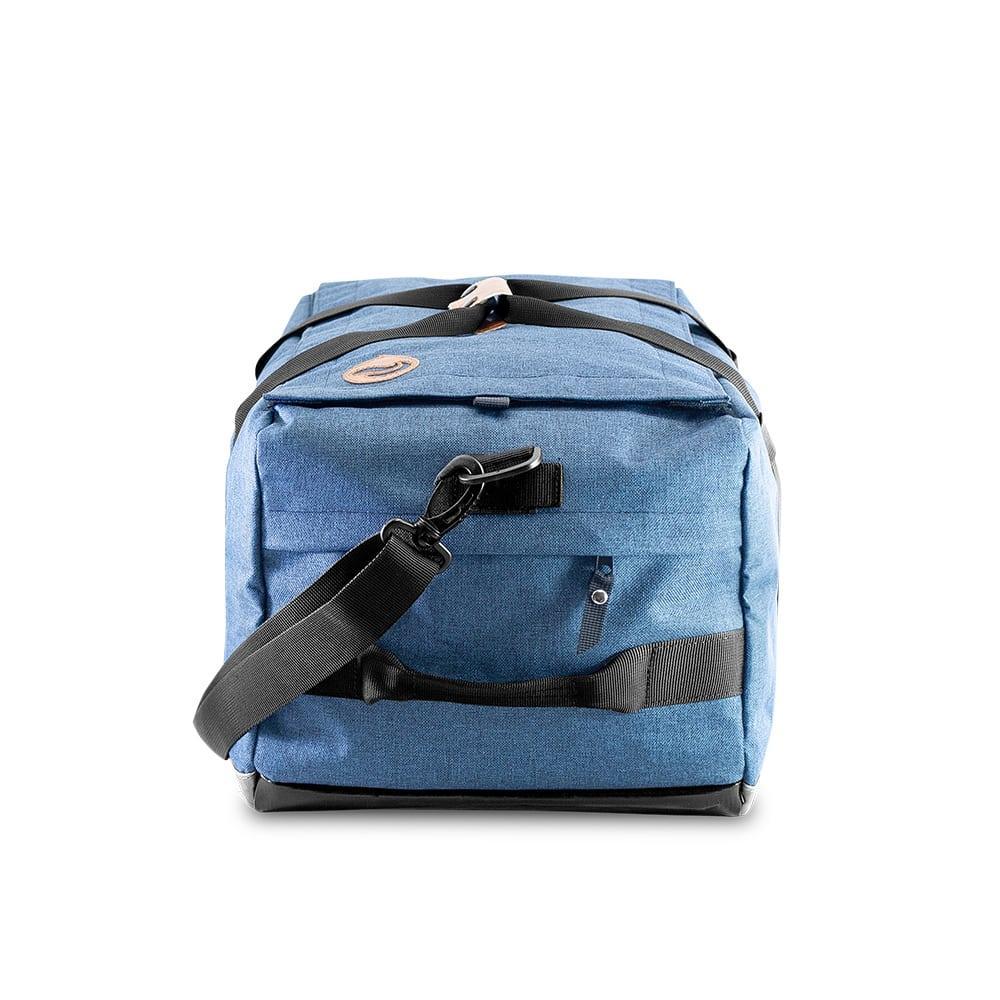 Blue denim hybrid duffle bag with black straps and a side zipper pocket, front view