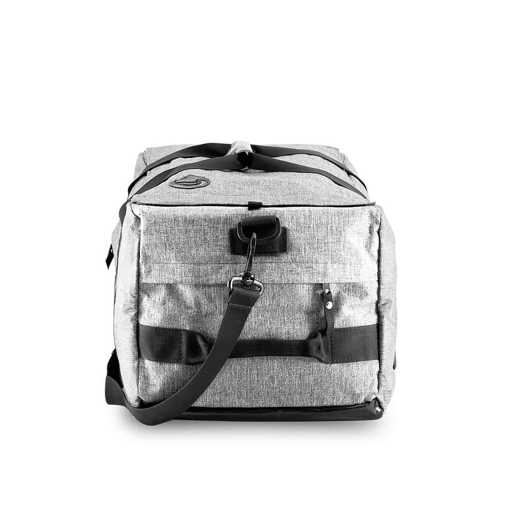 Gray hybrid duffle bag with front pocket, side strap, and durable fabric on white background.