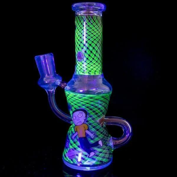Glowing green and purple glass bong with cartoon character, UV-reactive grid pattern, and curved handle