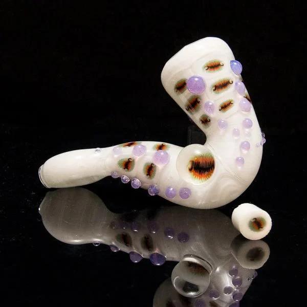 White glass pipe with purple accents and intricate designs, perfect for heady glass collectors
